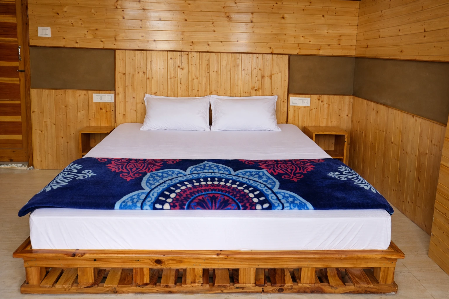 Cozy wooden interior room at Vintage Mud Wood stay in Jibhi Himachal